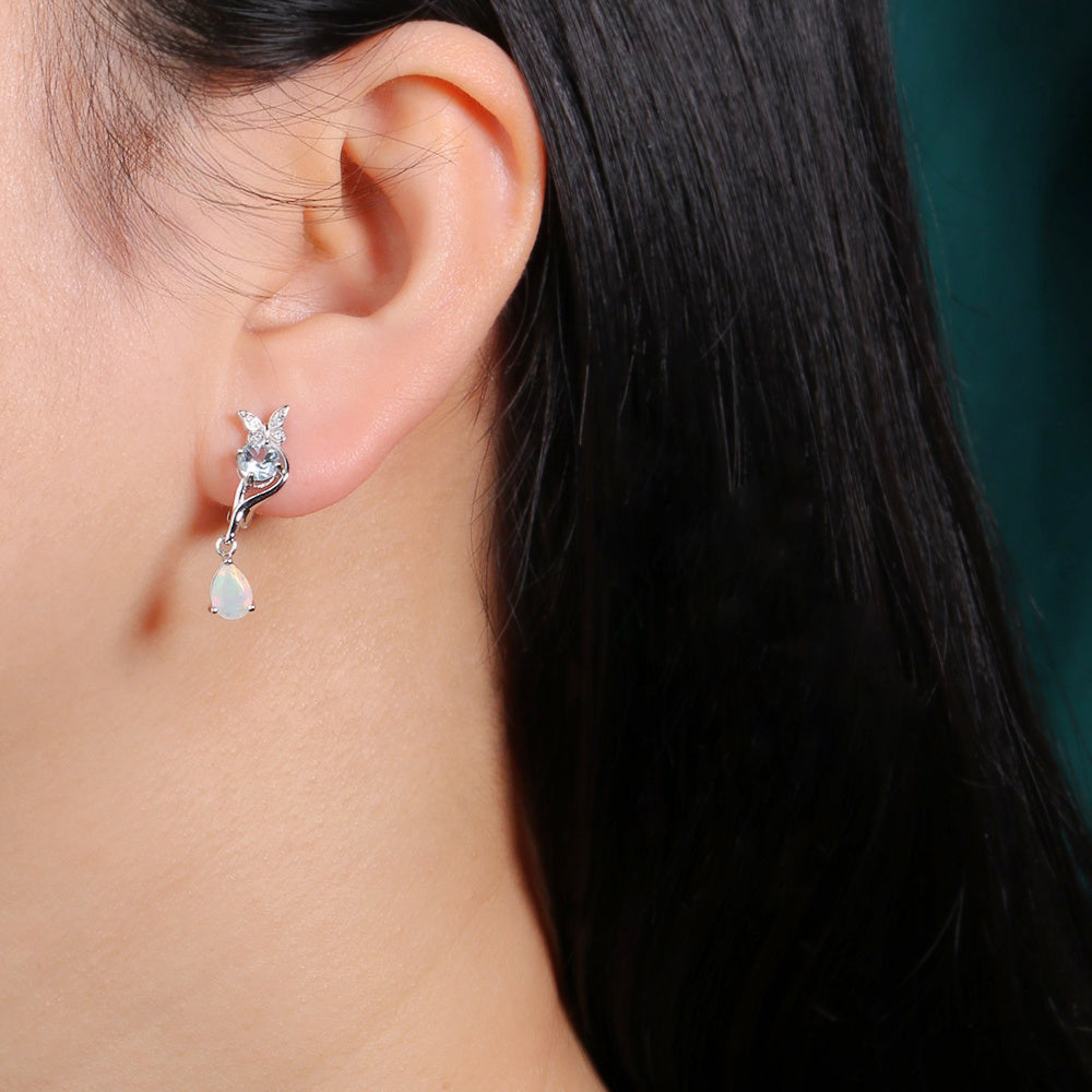 ‘Millie’ Butterfly Topaz Pear Opal Earrings – on ear