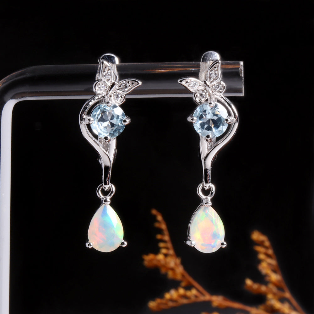 ‘Millie’ Butterfly Topaz Pear Opal Earrings – on display stand