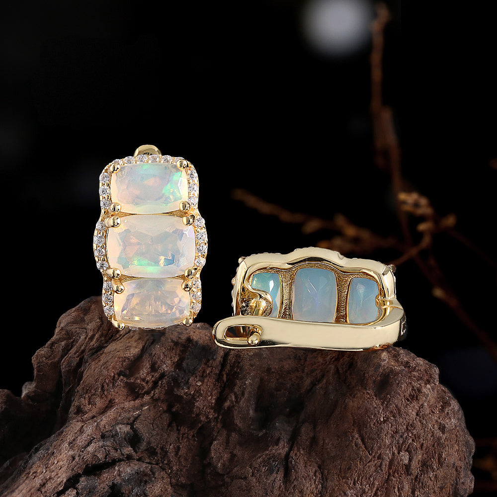 ‘Lottie’ Cushion Opal Three Stone Set – set on driftwood