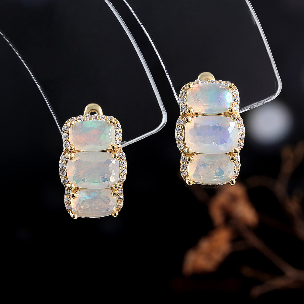 ‘Lottie’ Cushion Opal Three Stone Set – earrings on stand