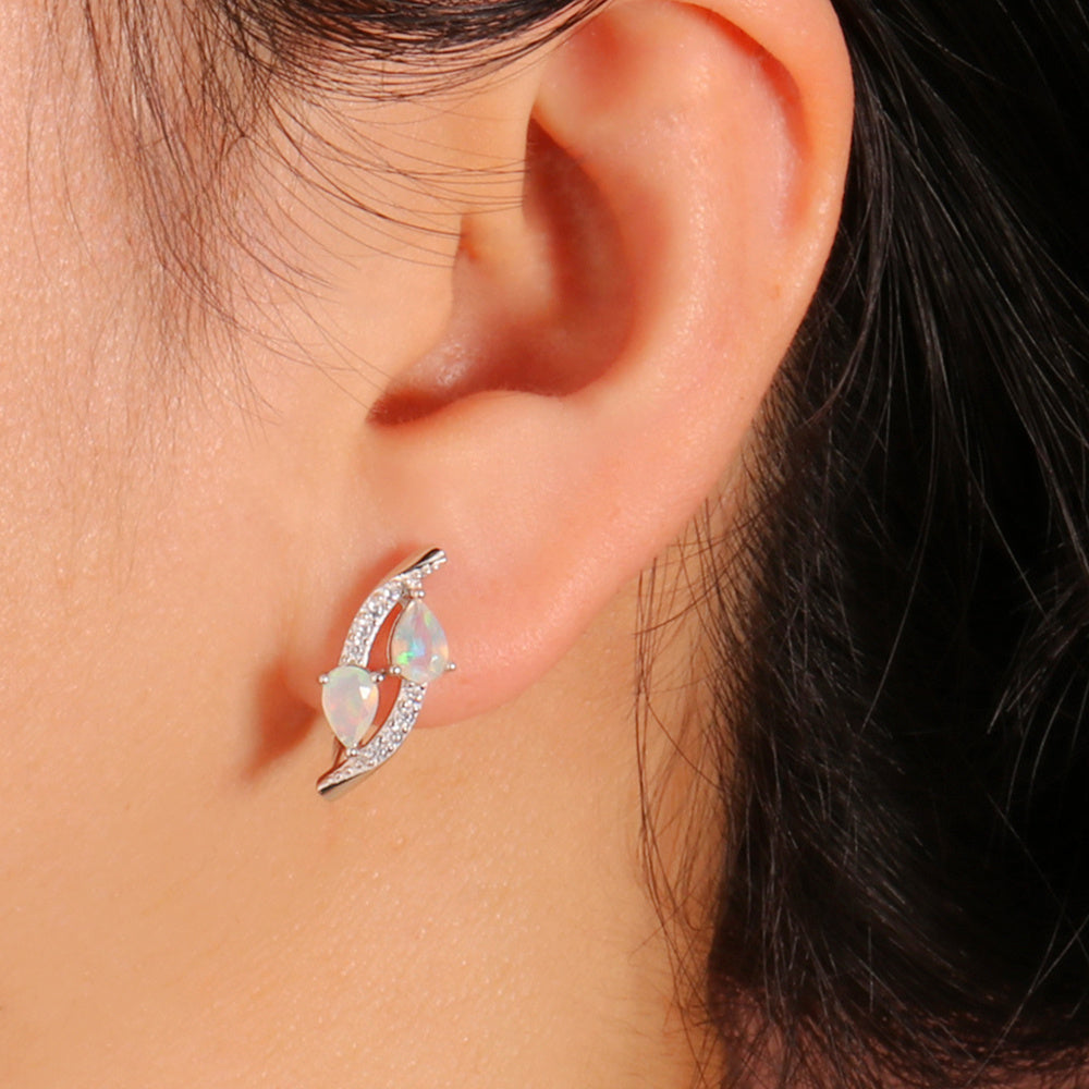 ‘Laguna’ Double Pear Opal Sweep Earrings – on ear