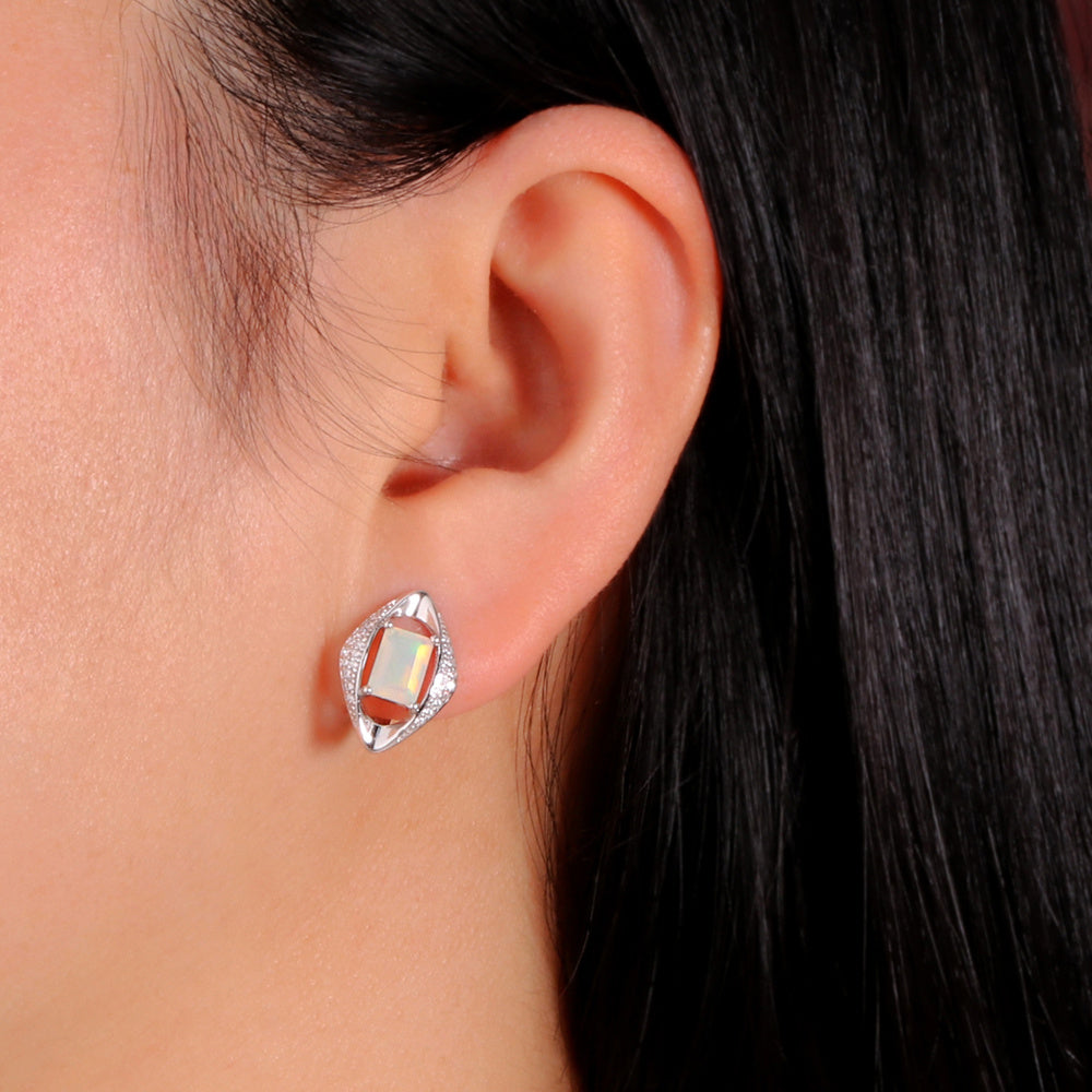 ‘Cecily’ Emerald Cut Opal Rhombus Earrings – white on ear