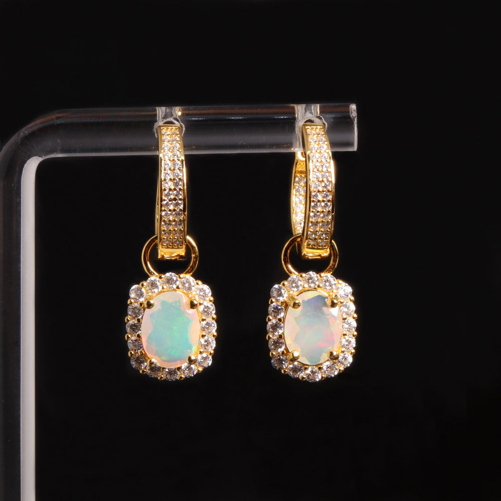 ‘Birdie’ Opal Halo Charm Huggie Earrings – on display stand