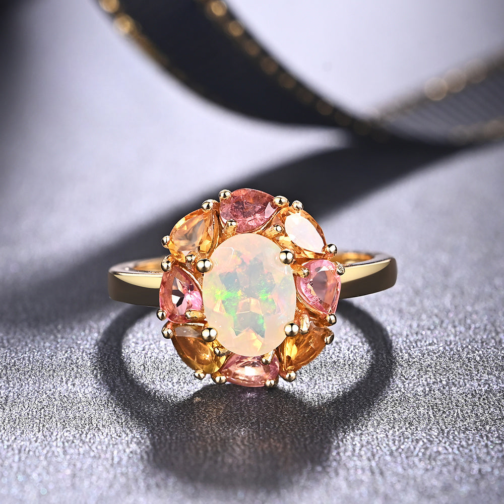 ‘Freesia’ Opal Tourmaline Flower Halo Ring – front on fabric