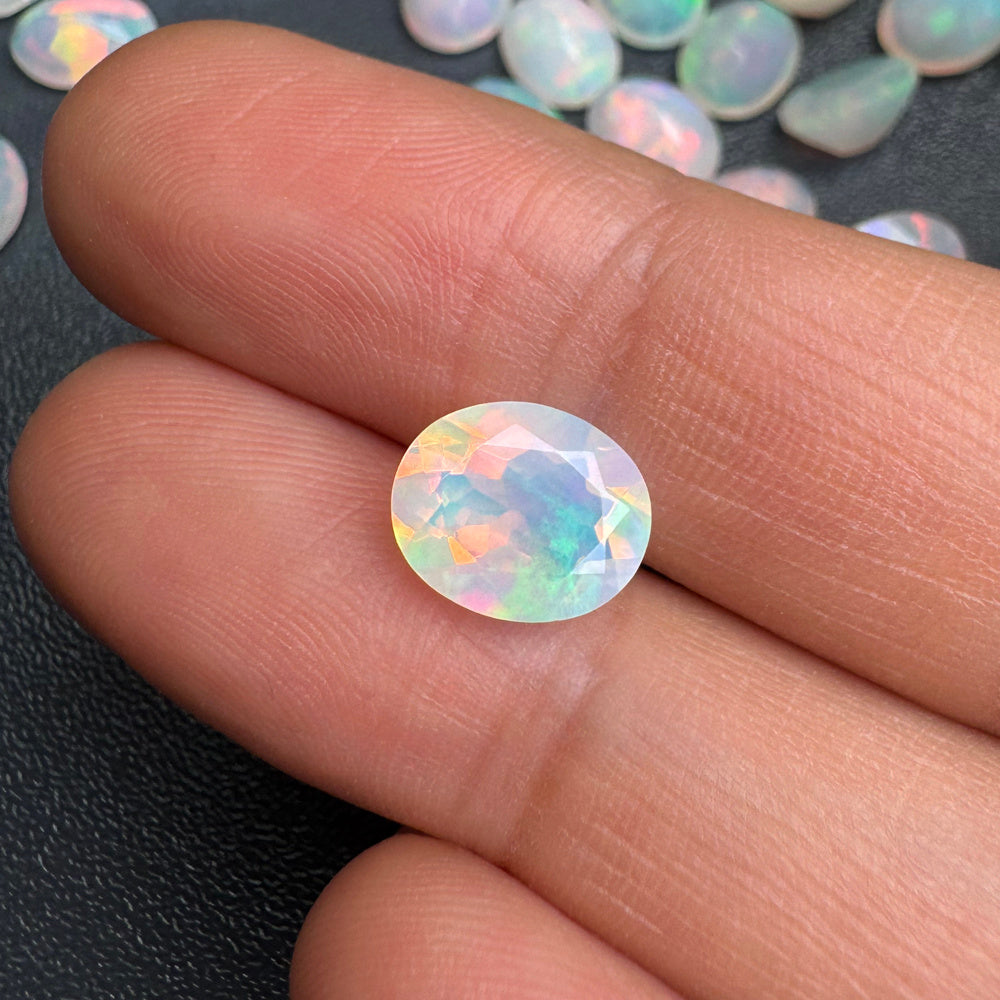 ‘Clancy’ Oval Faceted Opal Loose Stones – on finger