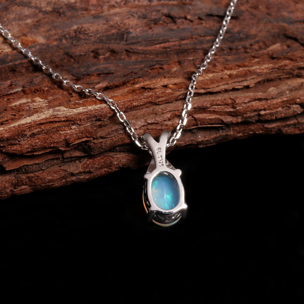 ‘Mercy’ Oval Opal Cross Bail Pendant – on wood