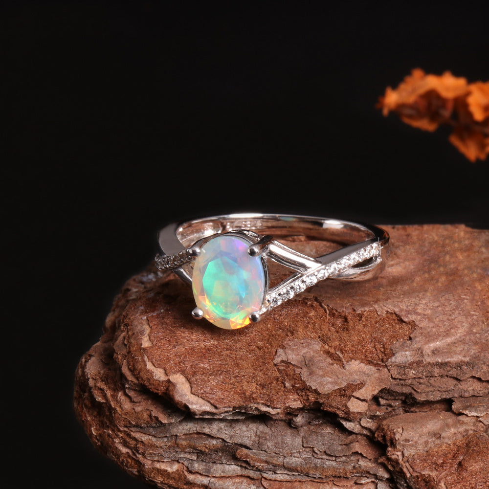 ‘Blythe’ Oval Opal Crossover Solitaire Ring – on wood