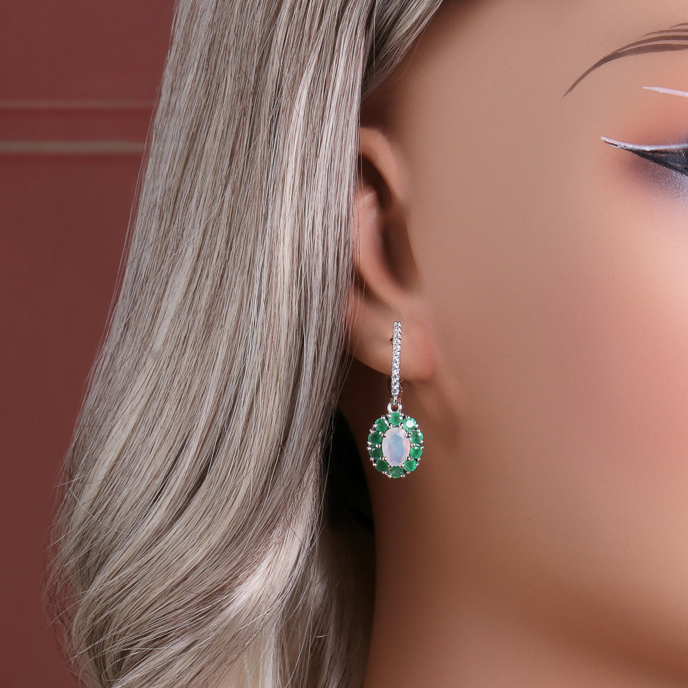 ‘Sylvie’ Oval Opal Emerald Halo Set – earring on ear