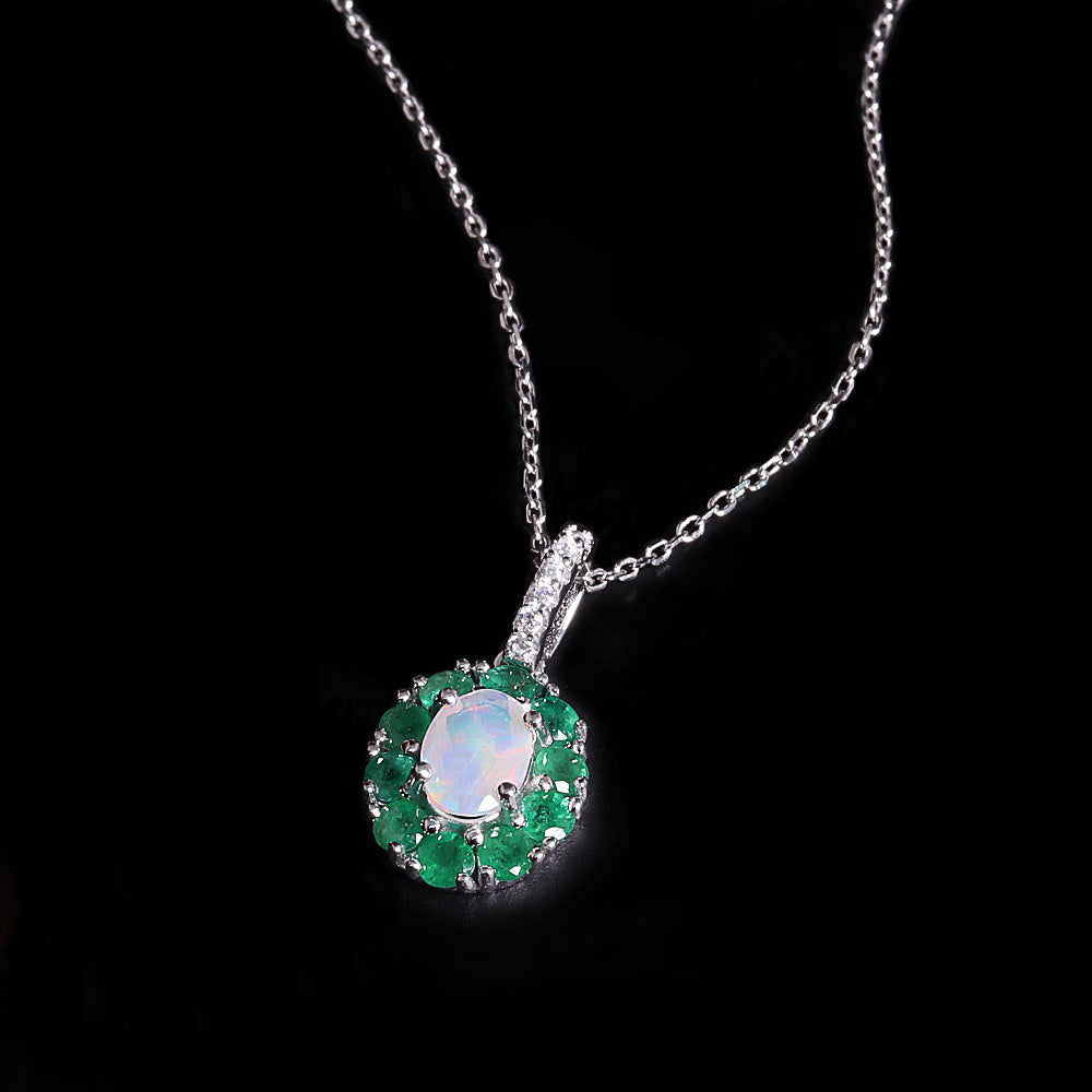 ‘Sylvie’ Oval Opal Emerald Halo Set – pendant angled