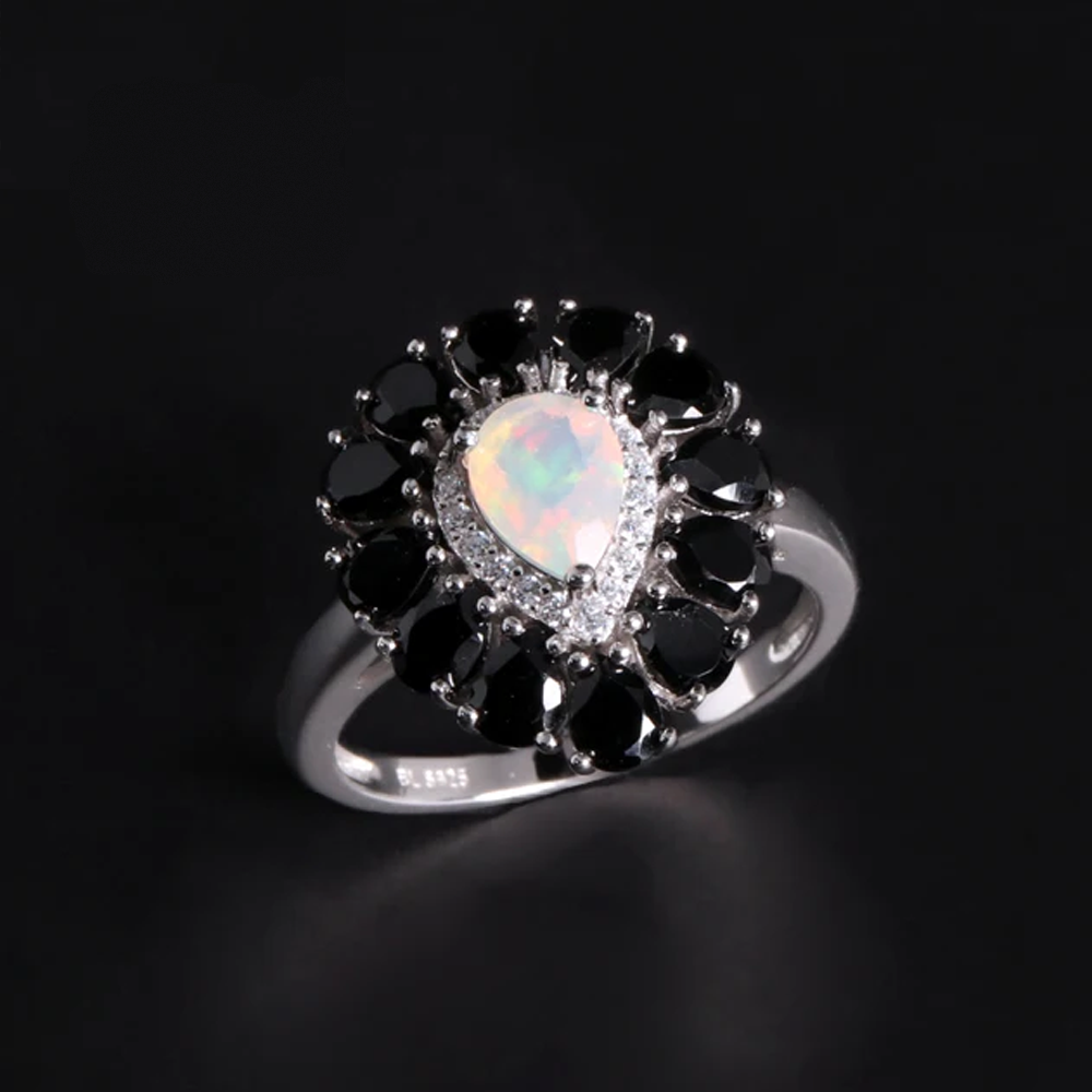 ‘Vela’ Pear Opal Spinel Halo Ring