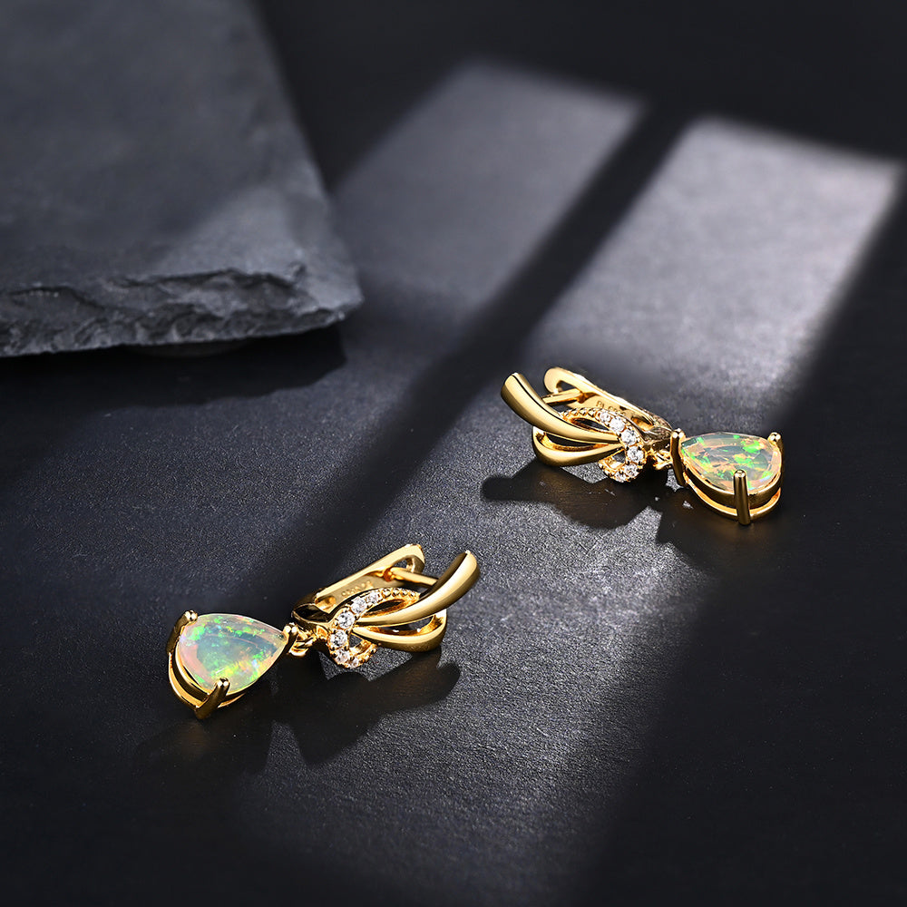 ‘Georgia’ Pear Opal Swirl Drop Earrings – lying on slate