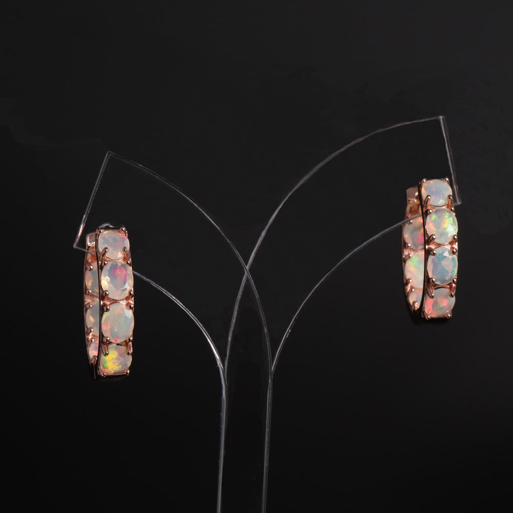 ‘Sunday’ Rose Gold Opal Hoop Earrings – hanging on stand