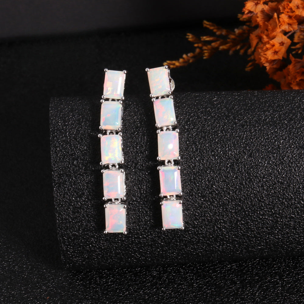 ‘Savannah’ Baguette Opal Line Drop Earrings – white pair front