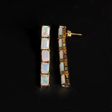 ‘Savannah’ Baguette Opal Line Drop Earrings – yellow side view