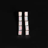 ‘Savannah’ Baguette Opal Line Drop Earrings – white pair front