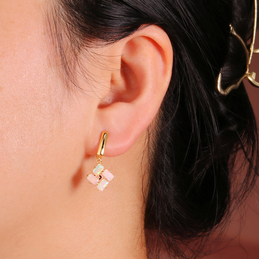 ‘Phoenix’ Baguette Opal Pinwheel Drop Earrings – on ear