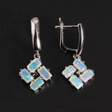 ‘Phoenix’ Baguette Opal Pinwheel Drop Earrings – front and side angle