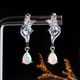 ‘Millie’ Butterfly Topaz Pear Opal Earrings – on display stand