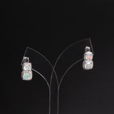 ‘Hadley’ Cushion Opal Double Halo Earrings – on display stand