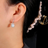‘Louise’ Cushion Opal Halo Hoop Earrings – on ear