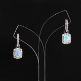‘Louise’ Cushion Opal Halo Hoop Earrings – on display stand