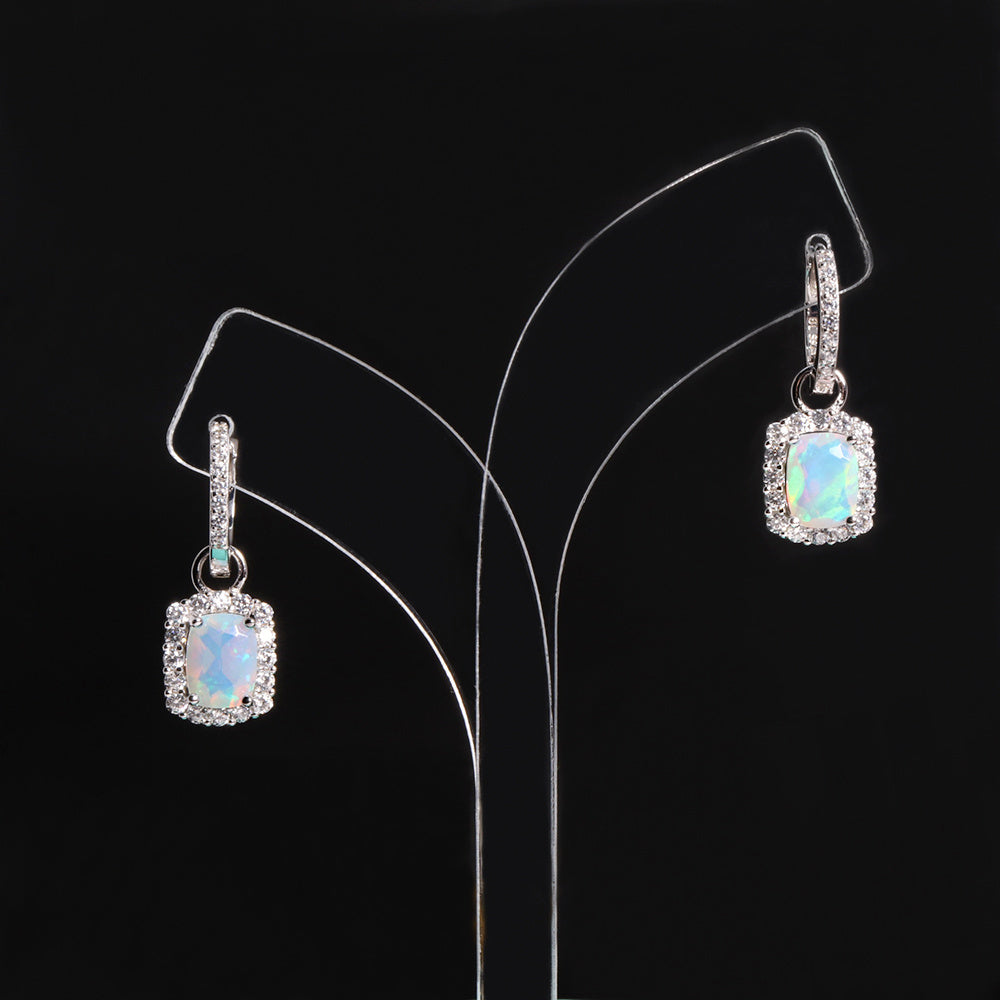 ‘Louise’ Cushion Opal Halo Hoop Earrings – on display stand