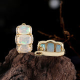 ‘Lottie’ Cushion Opal Three Stone Set – set on driftwood