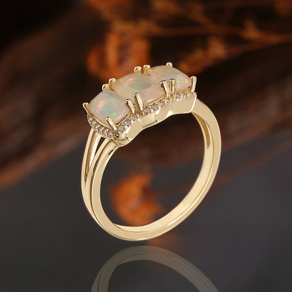 ‘Lottie’ Cushion Opal Three Stone Set – ring side bokeh