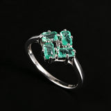 ‘Terra’ Four Emerald Square Cluster Ring – angle view