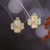 ‘Penny’ Four Leaf Clover Opal Earrings – hanging view