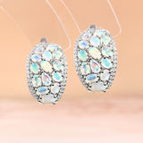 ‘Coralie’ Large Opal Cluster Dome Earrings – hanging view