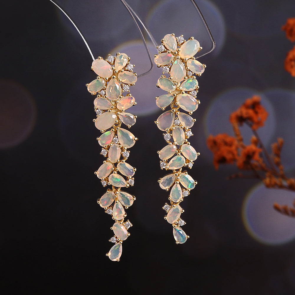 ‘Poppy’ Long Pear Opal Cluster Earrings – on display stand