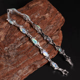 ‘Melrose’ Marquise Opal Cross Link Bracelet – on wood silver
