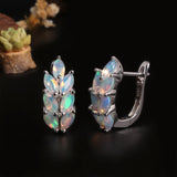 ‘Tawny’ Marquise Opal Wheat Huggie Earrings – angle with plant
