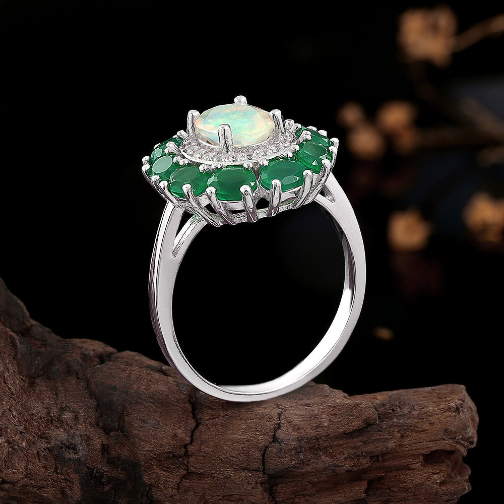 ‘Imogen’ Opal Green Agate Halo Ring – side on wood