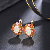 ‘Finch’ Opal Tourmaline Flower Halo Earrings – pair on fabric