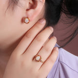 ‘Freesia’ Opal Tourmaline Flower Halo Ring – on ear and hand