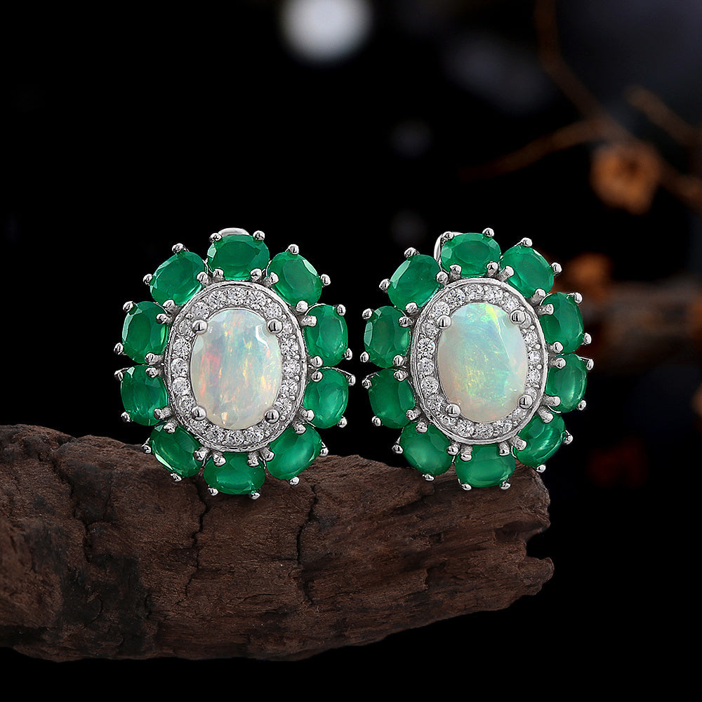 ‘Kallista’ Oval Opal Agate Halo Set – earrings on wood