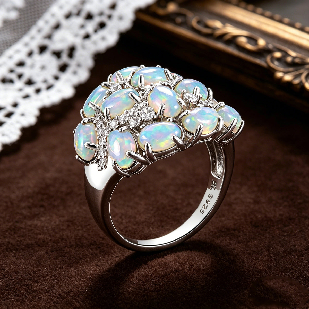 ‘Leigh’ Oval Opal Cluster Cocktail Ring – angled on lace