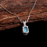 ‘Mercy’ Oval Opal Cross Bail Pendant – on wood