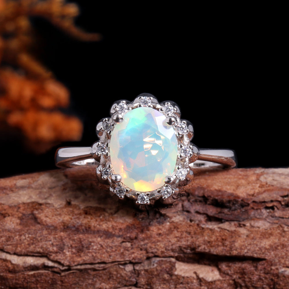 ‘Honora’ Oval Opal Crown Halo Ring – on wood