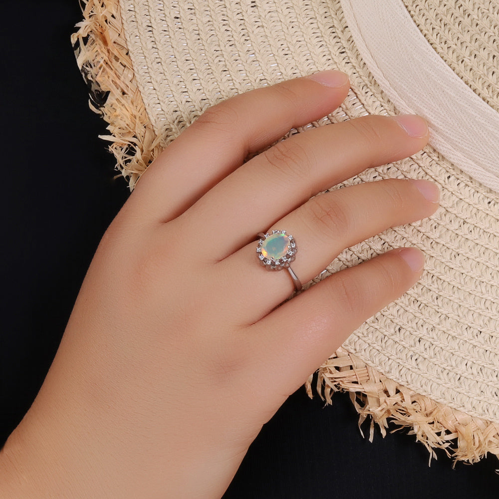 ‘Honora’ Oval Opal Crown Halo Ring – on hand