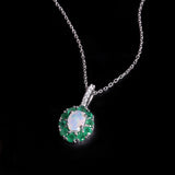 ‘Bexley’ Oval Opal Emerald Halo Pendant – angled front