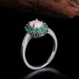‘Emmeline’ Oval Opal Emerald Halo Ring – angled view