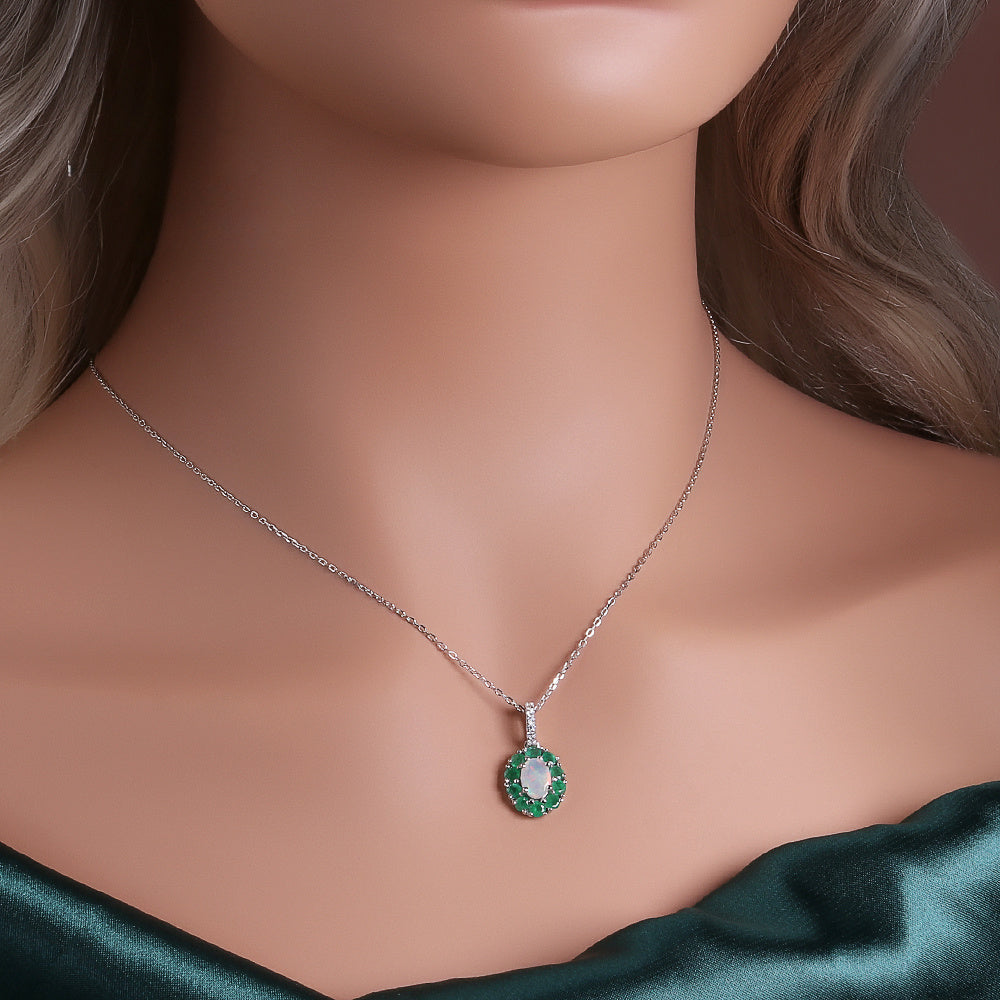 ‘Sylvie’ Oval Opal Emerald Halo Set – pendant on neck