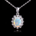 ‘Snowy’ Oval Opal Flower Halo Pendant