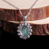 ‘Snowy’ Oval Opal Flower Halo Pendant – on wood