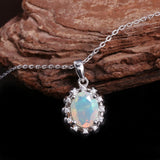‘Snowy’ Oval Opal Flower Halo Pendant – on wood