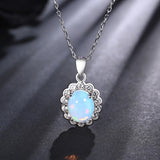 ‘Elsie’ Oval Opal Flower Halo Set – pendant