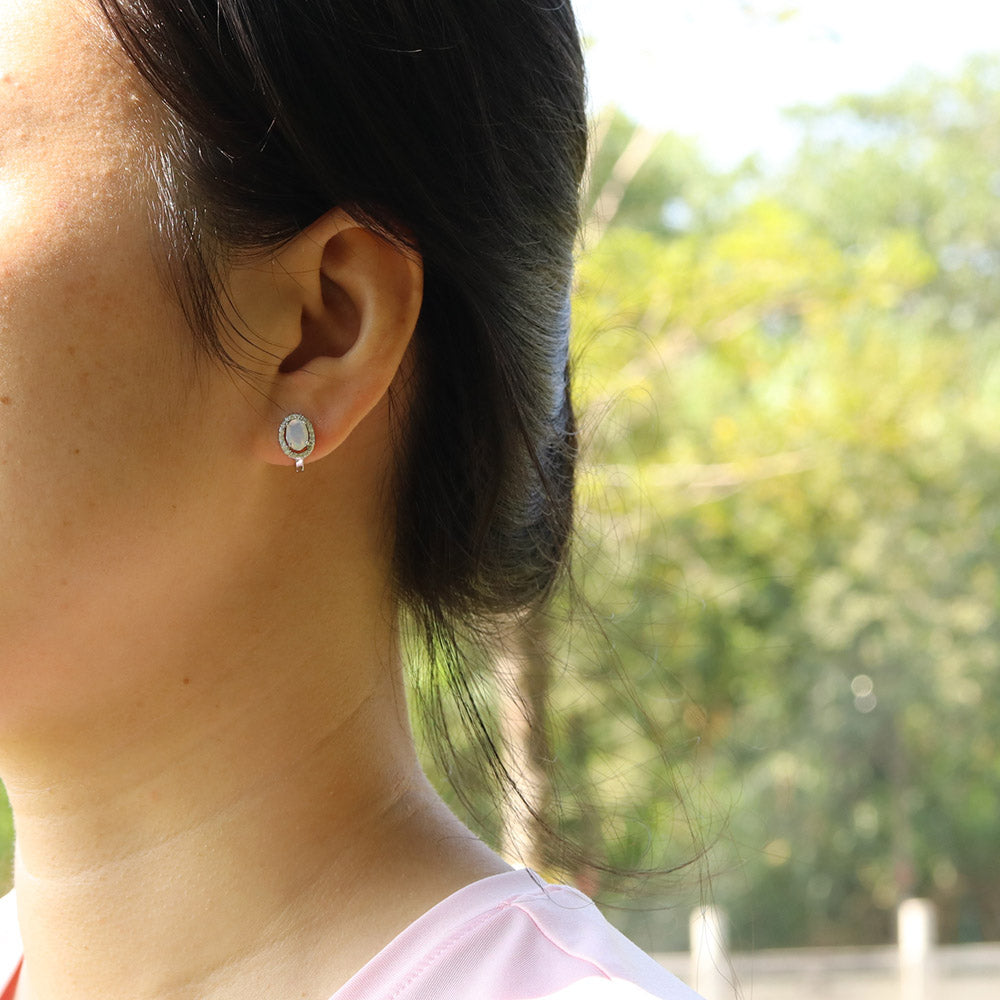 ‘Arlie’ Oval Opal Halo Clasp Earrings – on ear